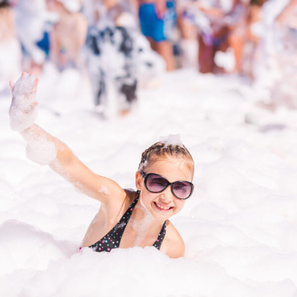 Foam,Party,On,The,Beach.,Cute,Little,Girl,Having,Fun